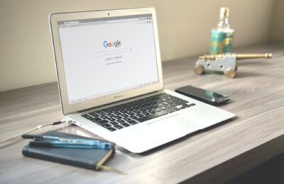 macbook air on grey wooden table