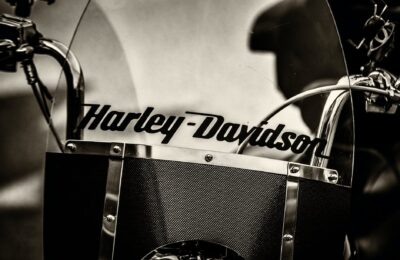 graysacle photography of black harley davidson motorcycle